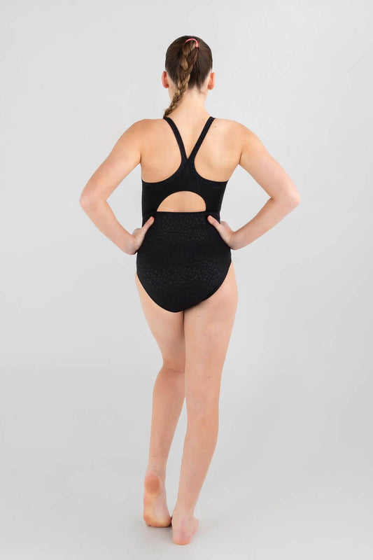 Back view of a gymnast in a black leotard with a cut-out and embossed cheetah print design.