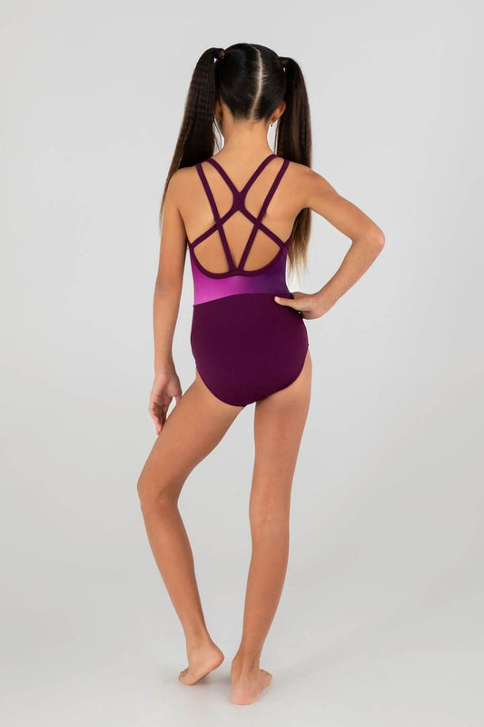 Child showcasing the stylish back of Glitz N Glam leotard with dark plum hues and crisscross strap detailing.