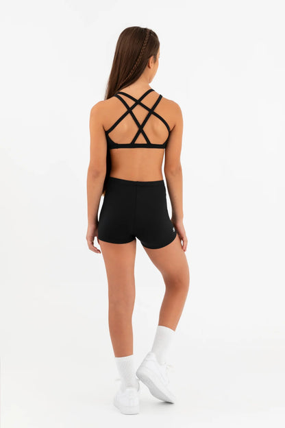 Person wearing a black sports bra and shorts set on a white background