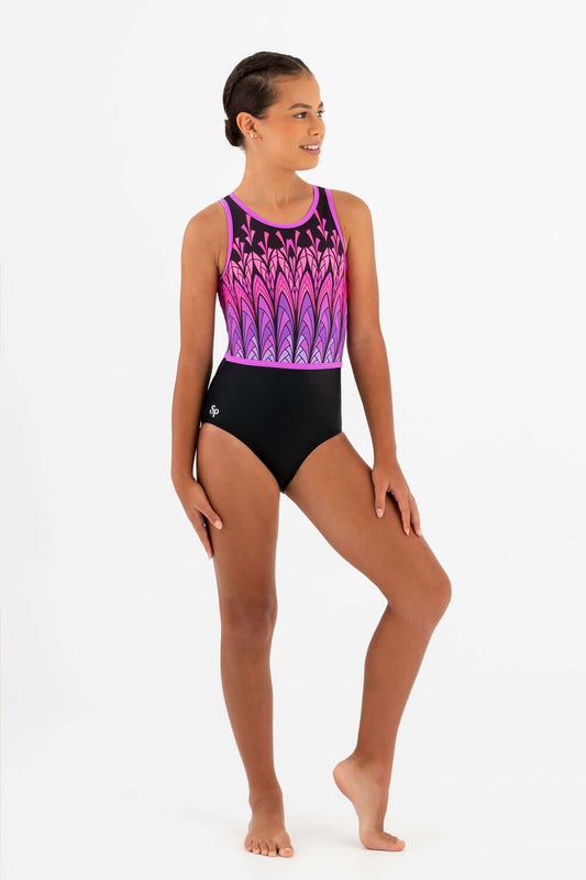 Girl showcasing the Folklore Leotard with vibrant pink and black design, perfect for gymnasts, dancers, or performers.
