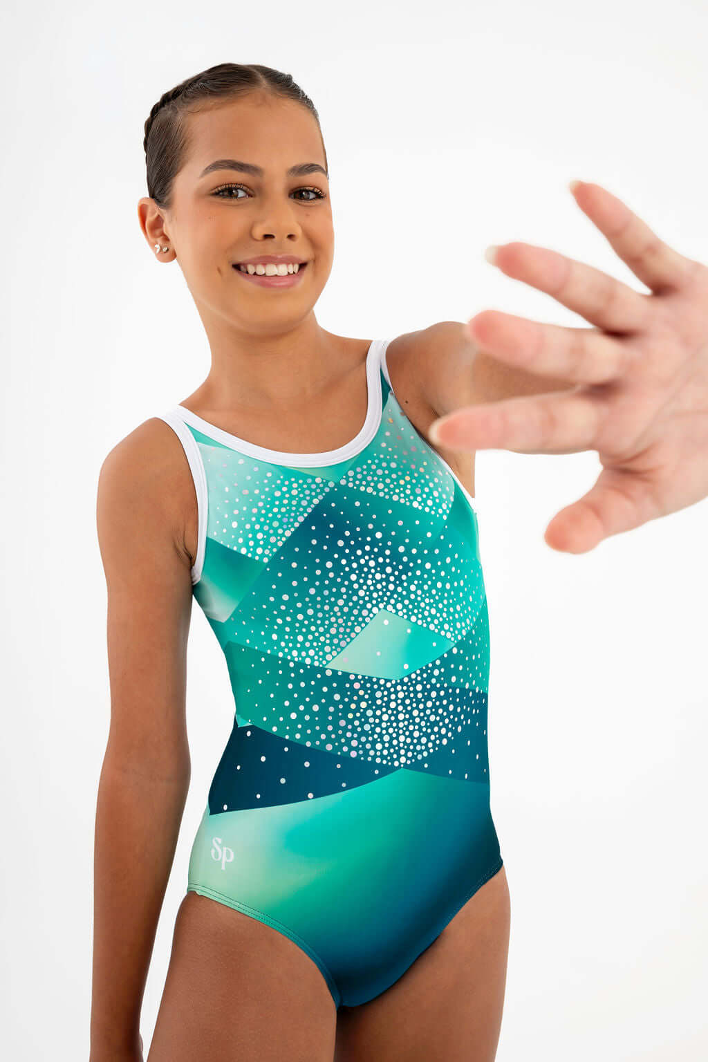 Girl smiling in the Marina Del Rey Leotard, showcasing teal hues and sparkling sequins.