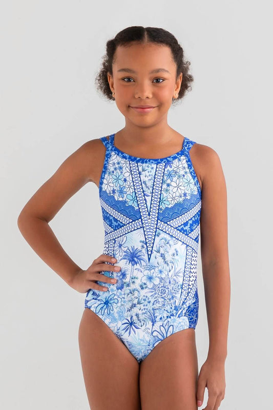 Girl smiling in a blue floral leotard, showcasing a vibrant design inspired by nature and elegance.
