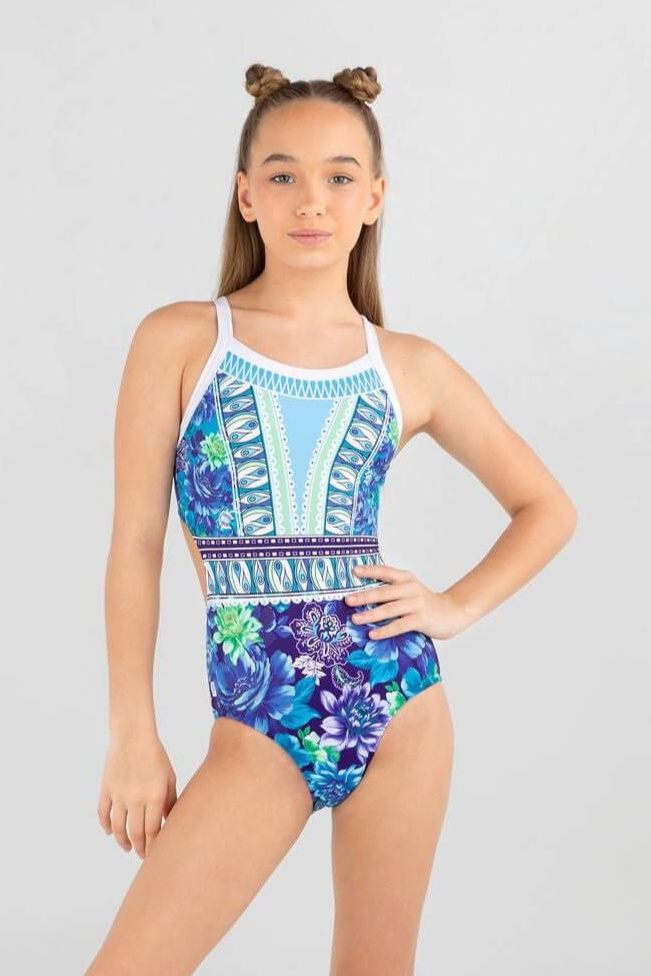 Girl in colorful leotard with coastal blue florals and geometric details, showcasing the essence of dancing with destiny.