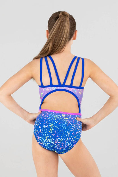 Back view of a girl wearing the Lost Paradise leotard featuring a sequined design and colorful ombre with three strap details.