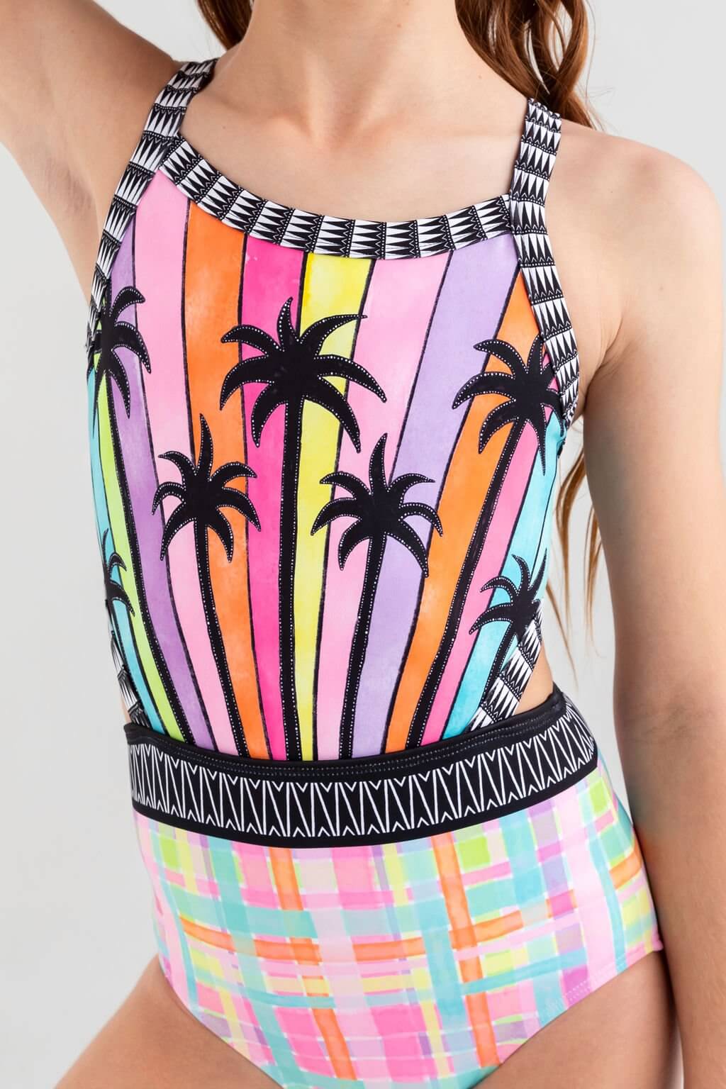 Mademoiselle Leotard in vibrant colors with palm trees and playful prints for fun, stylish comfort.